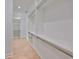 Bright walk-in closet showcasing custom shelving and ample storage, perfect for organizing any wardrobe at 3509 W Leona St, Tampa, FL 33629