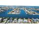 Aerial view of waterfront home with private dock and boat access at 440 115Th Ave, Treasure Island, FL 33706