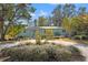 Light blue house with circular driveway and manicured landscaping at 454 35Th Ne Ave, St Petersburg, FL 33704