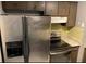 Stainless steel appliances and granite countertops in kitchen at 502 Calhoun Ave, Seffner, FL 33584