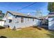 Side view of light blue house with small deck at 510 35Th N Ave, St Petersburg, FL 33704