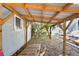 Covered patio with wooden structure and small window at 510 35Th N Ave, St Petersburg, FL 33704