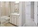 Clean bathroom boasts white vanity, shower, and tile floor at 6098 Shorebird Br, Land O Lakes, FL 34638