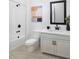 Modern bathroom with white vanity, black matte fixtures, and a large mirror at 6162 Timberdale Ave, Wesley Chapel, FL 33545