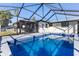 Refreshing screened pool and patio with outdoor kitchen and gazebo at 7330 Live Oak Ln, New Port Richey, FL 34653