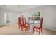 Dining room with red chairs and a glass-top table at 851 16Th S Ave, St Petersburg, FL 33701