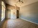 Bedroom with tiled floors, a closet, and window at 9405 N Mulberry St, Tampa, FL 33612