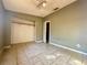 Bedroom with tiled floors and a closet at 9405 N Mulberry St, Tampa, FL 33612