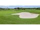 Sand trap on a lush green golf course at 10527 Machrihanish Cir, San Antonio, FL 33576