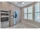 Stainless steel appliances and wood cabinets featured in this modern kitchen at 1069 Pinellas Bayway S, Tierra Verde, FL 33715