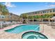 Community pool and spa with ample lounge space at 1069 Pinellas Bayway S, Tierra Verde, FL 33715