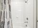 Bathroom with shower/tub combo and white tiled walls at 10828 Verawood Dr, Riverview, FL 33579