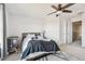 Cozy bedroom with a bed, ceiling fan and window at 10828 Verawood Dr, Riverview, FL 33579