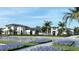 Community building with parking lot and lush landscaping at 11211 Livewell Ct, Venice, FL 34293