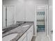Bathroom with double vanity and granite countertop at 11321 Chilly Water Ct, Riverview, FL 33569