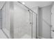 Clean bathroom with a shower stall and tiled walls at 11321 Chilly Water Ct, Riverview, FL 33569