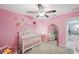 Charming Bedroom with a crib, mirror and custom wall decor at 11321 Chilly Water Ct, Riverview, FL 33569