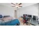 Functional bedroom with a built-in workspace and a comfortable bed at 11321 Chilly Water Ct, Riverview, FL 33569