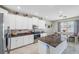 Eat-in kitchen featuring granite countertops and white cabinets at 11321 Chilly Water Ct, Riverview, FL 33569