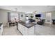 Open floor plan with kitchen island, granite countertops, and living room view at 11321 Chilly Water Ct, Riverview, FL 33569