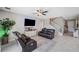 Open living room with leather sofas and a view of the stairs at 11321 Chilly Water Ct, Riverview, FL 33569