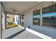 Covered patio with ceiling fan and backyard access at 11321 Chilly Water Ct, Riverview, FL 33569