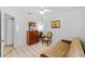 Functional bedroom with a futon and wooden dresser at 1202 Sawdust Ct, Valrico, FL 33596