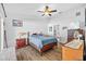 Cozy bedroom with wood flooring and built-in wooden dresser at 1202 Sawdust Ct, Valrico, FL 33596