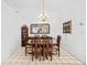 Bright dining room with a wood table and chandelier at 1202 Sawdust Ct, Valrico, FL 33596