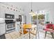 Kitchen with white cabinets, stainless steel appliances, and breakfast nook at 1202 Sawdust Ct, Valrico, FL 33596