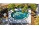 Inviting kidney-shaped pool with surrounding patio at 1202 Sawdust Ct, Valrico, FL 33596