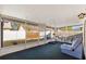 Relaxing screened porch with seating and backyard views at 1202 Sawdust Ct, Valrico, FL 33596