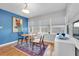 Bright breakfast nook with hardwood floors and blue accent wall at 1219 46Th N Ave, St Petersburg, FL 33703