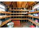 Organized storage shed with wooden shelves and ample storage space at 12305 N Rome Ave, Tampa, FL 33612