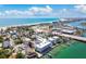Aerial view of the property showcasing the waterfront condo complex, beaches, and ocean at 143 94Th Ave # 2, Treasure Island, FL 33706