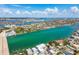 Sprawling aerial view capturing the intercoastal waterway, bridge, and picturesque residential areas with lush landscaping at 143 94Th Ave # 2, Treasure Island, FL 33706
