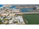 Scenic aerial view featuring a marina, waterfront homes, and a bridge connecting to distant shores at 143 94Th Ave # 2, Treasure Island, FL 33706