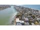 Stunning aerial view showcasing waterfront properties with boat docks along a tranquil canal at 143 94Th Ave # 2, Treasure Island, FL 33706