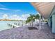 Waterfront property with a brick patio and beautiful view of the pier at 143 94Th Ave # 2, Treasure Island, FL 33706