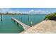 Inviting walkway and private dock offering direct access to tranquil waters and beautiful views for waterfront living at 143 94Th Ave # 2, Treasure Island, FL 33706