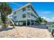 Attractive waterfront condo complex on stilts, offering parking and recreational amenities near the docks and beach at 143 94Th Ave # 2, Treasure Island, FL 33706
