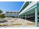 Lovely exterior of a waterfront building raised on stilts for covered parking in a quiet residential neighborhood at 143 94Th Ave # 2, Treasure Island, FL 33706