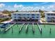 Waterfront condo complex with covered parking and a shared boat dock for easy access to the water at 143 94Th Ave # 2, Treasure Island, FL 33706