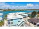 Charming waterfront condo complex with covered parking, white trim and a shared boat dock at 143 94Th Ave # 2, Treasure Island, FL 33706