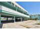 Multi-story condo building with covered parking and waterfront views at 143 94Th Ave # 2, Treasure Island, FL 33706