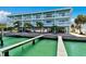 Waterfront building featuring covered parking and outdoor balconies at 143 94Th Ave # 2, Treasure Island, FL 33706