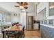 Bright kitchen and dining area features a stainless fridge and stylish dining table for casual meals at 143 94Th Ave # 2, Treasure Island, FL 33706