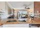 Kitchen sink and granite countertops with view of the living room and balcony at 143 94Th Ave # 2, Treasure Island, FL 33706