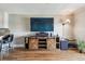 Living room with entertainment center with sliding barn doors at 143 94Th Ave # 2, Treasure Island, FL 33706