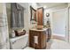 Elegant bathroom with double sinks, a large vanity, and decorative mirror at 143 94Th Ave # 2, Treasure Island, FL 33706
